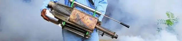 Fumigation technician using a fogger for deep pest treatment in Providence, RI